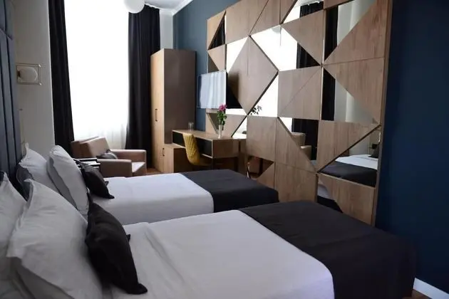 Deluxe Tek Büyük veya İki Ayrı Yataklı Oda
