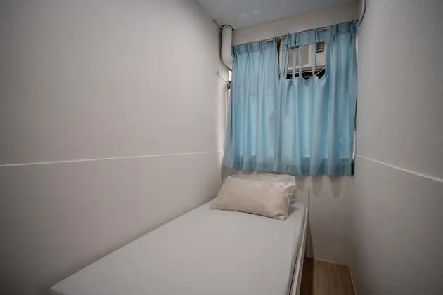 Single bed with shared bathroom