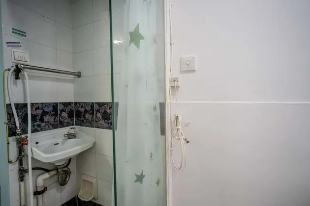 Single bed with shared bathroom