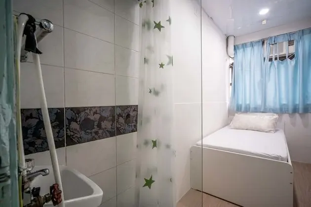 Single bed with shared bathroom
