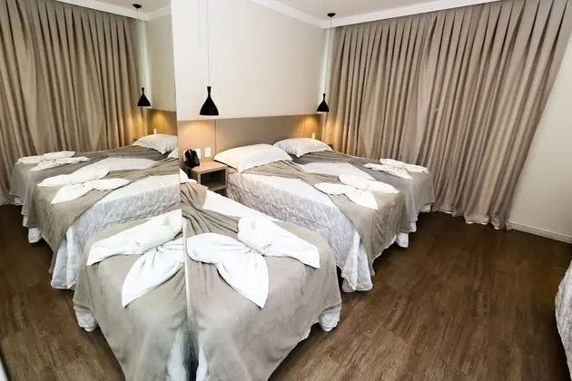 Suíte Triplo Luxo com sacada