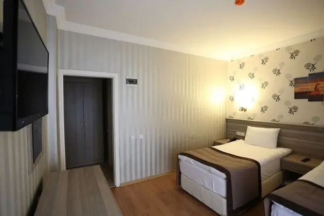 Deluxe Tek Büyük veya İki Ayrı Yataklı Oda