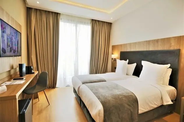 Deluxe Tek Büyük veya İki Ayrı Yataklı Oda