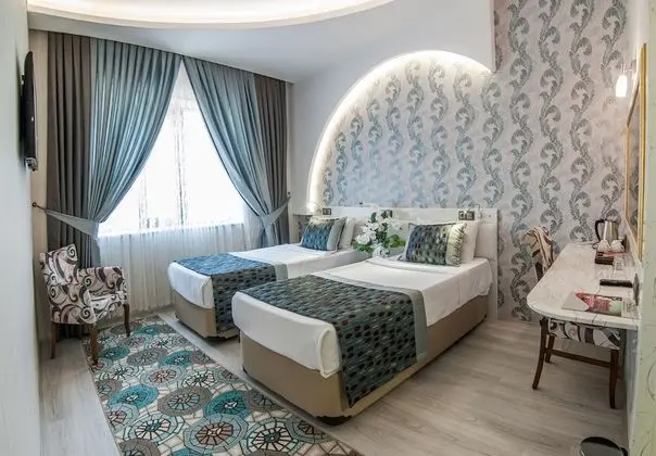 Deluxe Tek Büyük veya İki Ayrı Yataklı Oda