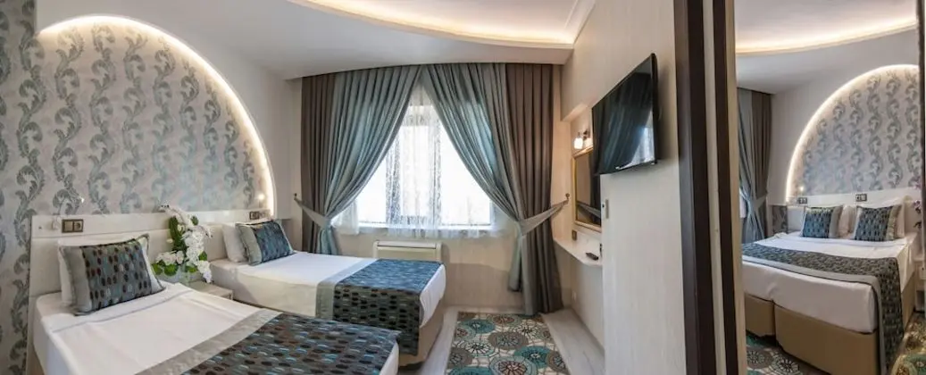 Deluxe Tek Büyük veya İki Ayrı Yataklı Oda