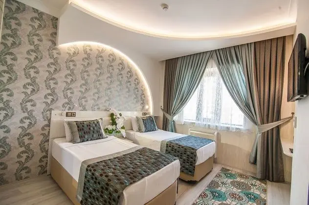 Deluxe Tek Büyük veya İki Ayrı Yataklı Oda