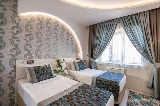 Deluxe Tek Büyük veya İki Ayrı Yataklı Oda