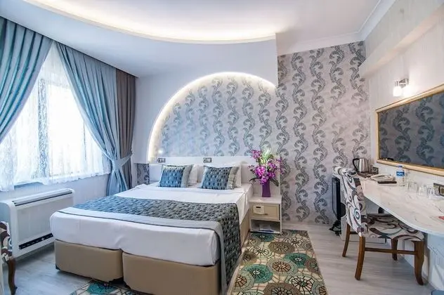 Deluxe Tek Büyük veya İki Ayrı Yataklı Oda