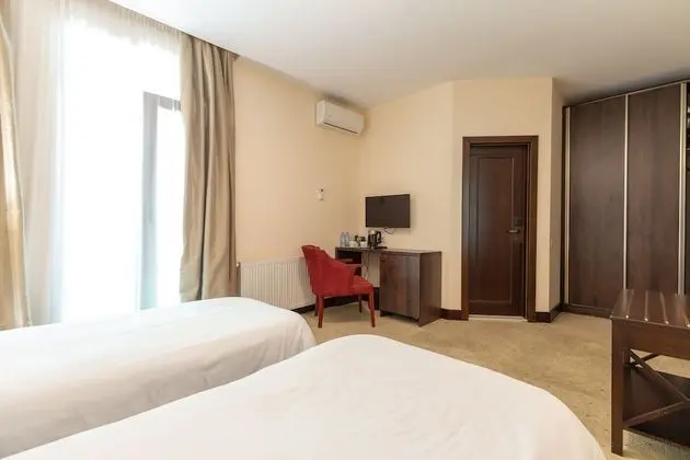 Deluxe Tek Büyük veya İki Ayrı Yataklı Oda