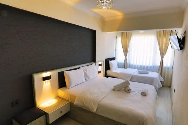 Ekonomik Üç Kişilik Oda,Şehir Manzaralı,Balkonsuz
