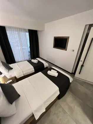 Deluxe Tek Büyük veya İki Ayrı Yataklı Oda