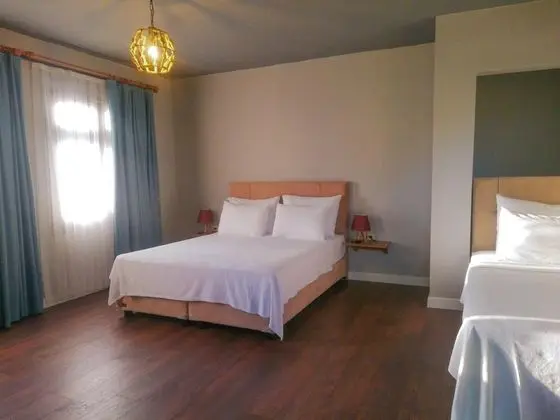Deluxe Üç Kişilik Oda , Deniz Manzaralı, Bahçe Katı