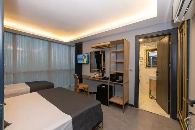 Deluxe Tek Büyük veya İki Ayrı Yataklı Oda