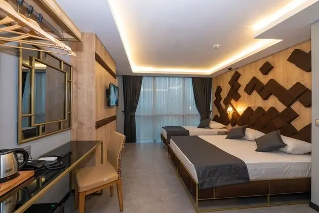 Deluxe Tek Büyük veya İki Ayrı Yataklı Oda