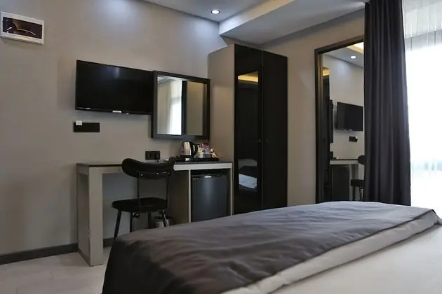 Deluxe Tek Büyük veya İki Ayrı Yataklı Oda