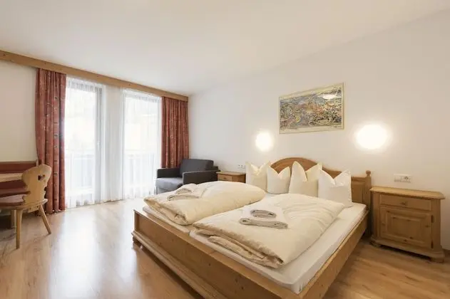 Double room with 2 extra beds. 2 Adults + 2 Children