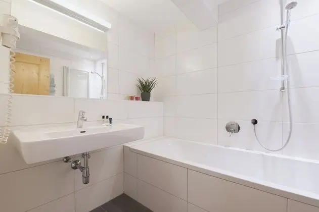 Double room with 2 extra beds. 2 Adults + 2 Children