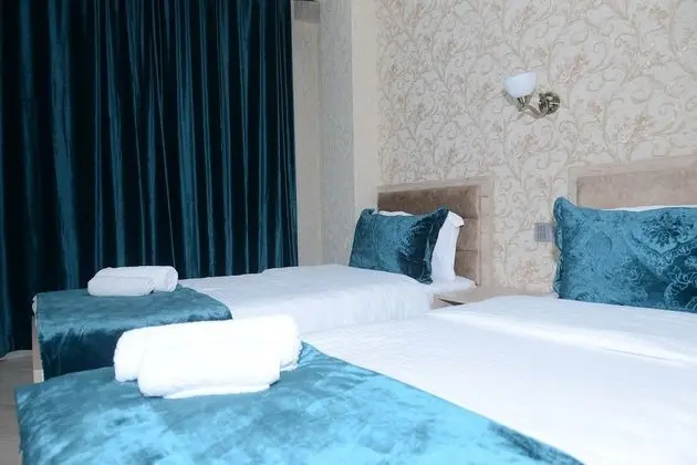 Deluxe Tek Büyük veya İki Ayrı Yataklı Oda