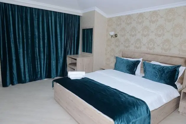 Deluxe Tek Büyük veya İki Ayrı Yataklı Oda