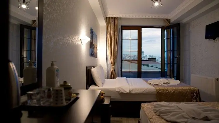Deluxe Üç Kişilik Oda - Deniz Manzaralı
