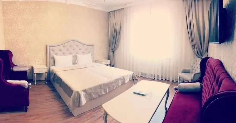Deluxe Tek Büyük veya İki Ayrı Yataklı Oda