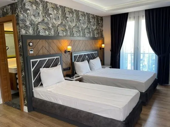 Deluxe Üç Kişilik Oda, Birden Çok Yatak