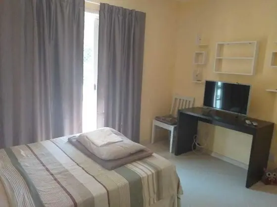 Deluxe Tek Büyük Yataklı Oda, Ortak Banyo (com Varanda)