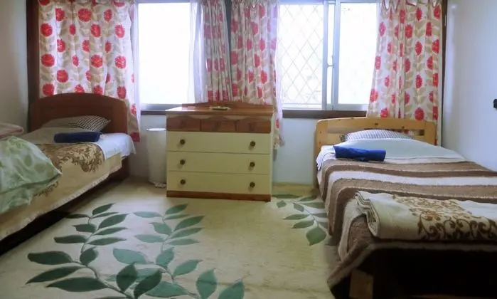 İki Ayrı Yataklı Oda, 2 Tek Kişilik Yatak, Ortak Banyo, Bahçe Manzaralı (1st Floor)
