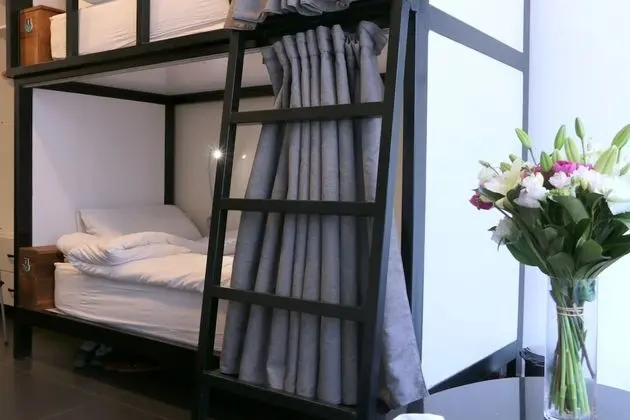 Shared Dorm (Men): 1 room: 6 single bunk beds for 6 persons, with 1 sharing bathroom