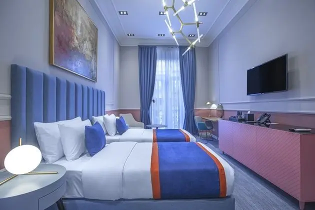 Deluxe Tek Büyük veya İki Ayrı Yataklı Oda