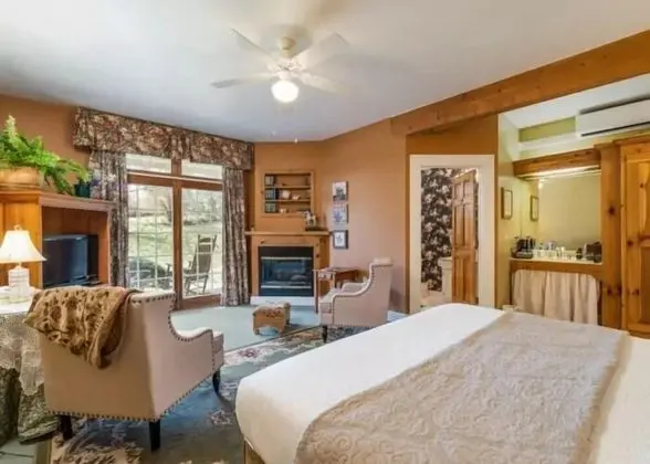 Woodward House Room with Fireplace and Patio