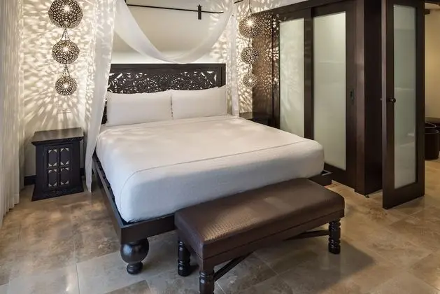 Junior King Suite with Partial Pool View and Balcony