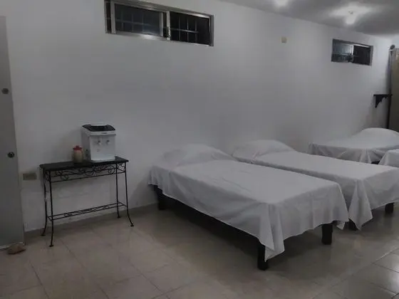Dormitorio compartido, camas individuales