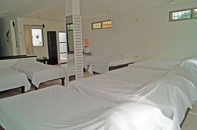 Dormitorio compartido, camas individuales
