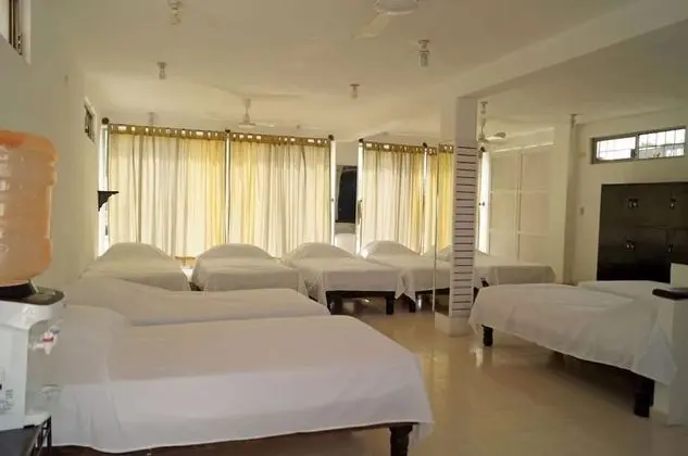 Dormitorio compartido, camas individuales