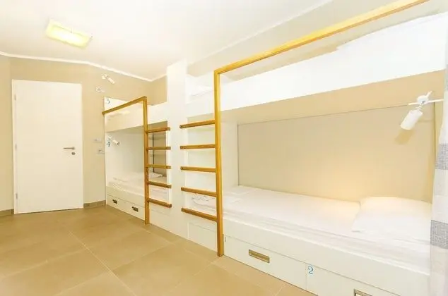 Bed in 4-Bed Dormitory Room with Private Bathroom