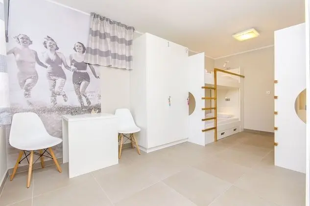 Bed in 4-Bed Dormitory Room with Shared Bathroom