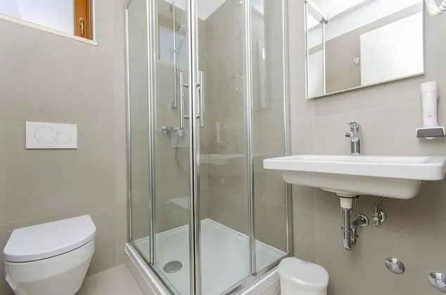 Bed in 4-Bed Dormitory Room with Shared Bathroom