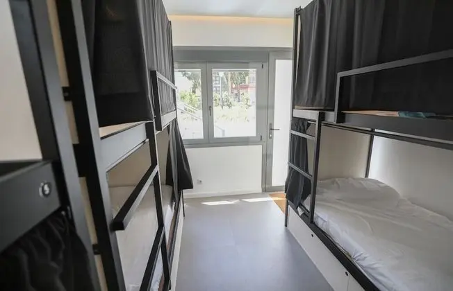 1 cama en habitación compartida de 10 camas, baño privado