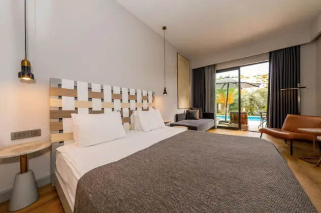 https://images.odamax.com/img/1024x768/odamax/image/upload/Jiva_Beach_Resort_Hotel_202601221542103_Swim_up_Room1.png