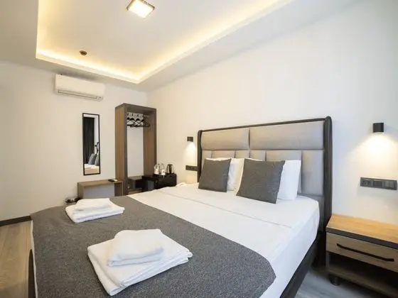 Deluxe Uc Kisilik Oda