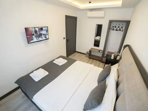 Deluxe Uc Kisilik Oda