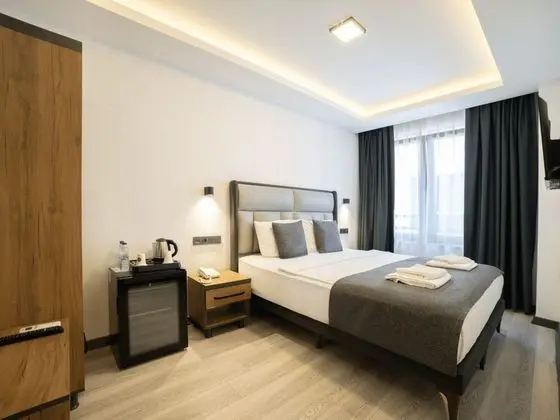 Deluxe Uc Kisilik Oda