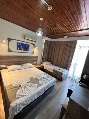 Üç Kişilik Oda