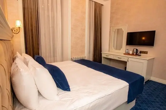 Deluxe Tek Büyük veya İki Ayrı Yataklı Oda, Balkon
