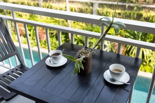 Deluxe King with Balcony, Pool View