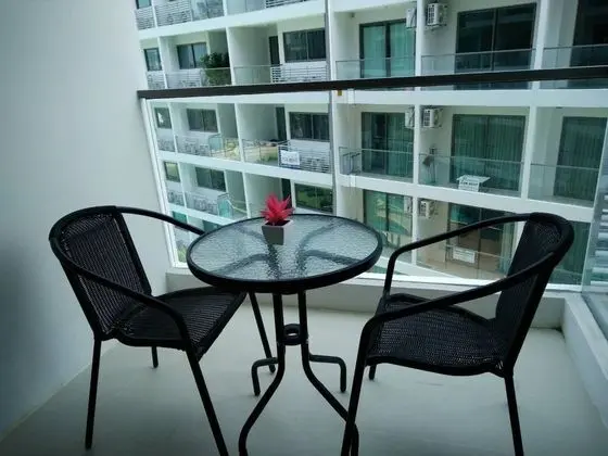 one bedroom with balcony pool view