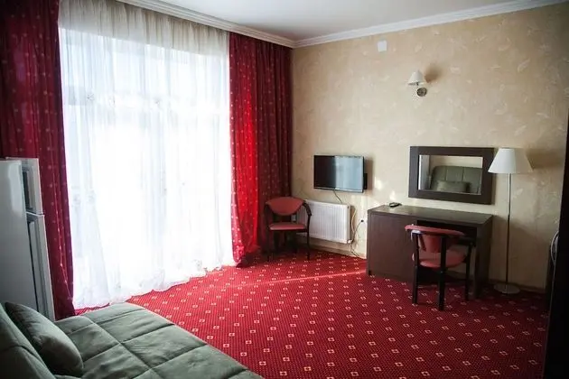 Comfort Tek Büyük veya İki Ayrı Yataklı Oda (+ sofa)