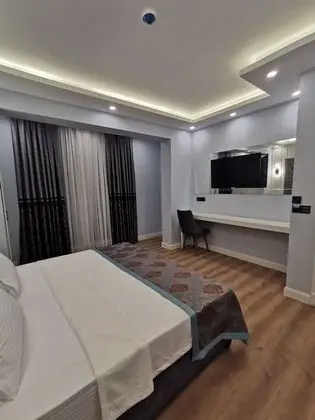 Deluxe Tek Büyük veya İki Ayrı Yataklı Oda