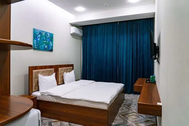 Deluxe Tek Büyük veya İki Ayrı Yataklı Oda